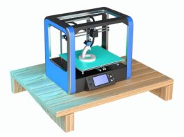 High-resolution realistic photograph of a compact desktop 3D printer in a home or school environment, showing the printer in action with a partially printed object. Avoid futuristic or stylized elements.