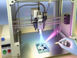 Laser-Assisted 3D Printing Enables Instant Thermoset Electronics High-resolution realistic photograph of a laser-assisted 3D printer fabricating a small thermoset-based electronic component in a lab environment, with visible laser beam and cured material. Avoid futuristic or stylized elements.