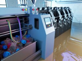 Turn Your Failed 3D Prints into New Filament with ExtrudeX High-resolution realistic photograph of ExtrudeX recycling failed 3D prints into filament, photographed in a real workshop or makerspace environment, matching the look of existing press images about the same product. Avoid futuristic or stylized elements.