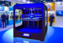 9 Obscure 3D Printing Sites You Need To Check Out High-resolution realistic photograph of a 3D printer in action, photographed in a real environment, matching the look of existing press images about the same. Avoid futuristic or stylized elements.